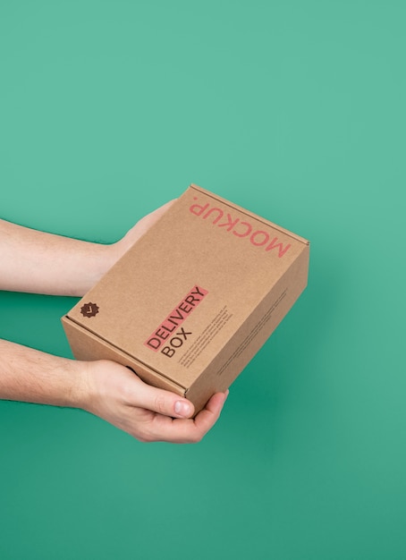 Hands holding mailing box mockup