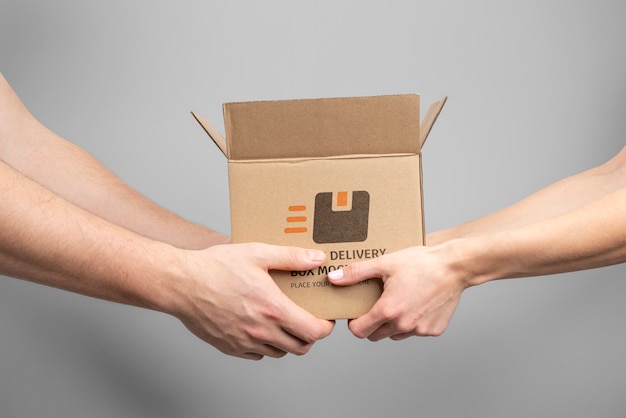 Hands holding mailing box mockup