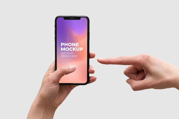 Hands holding smartphone device mock-up on color background