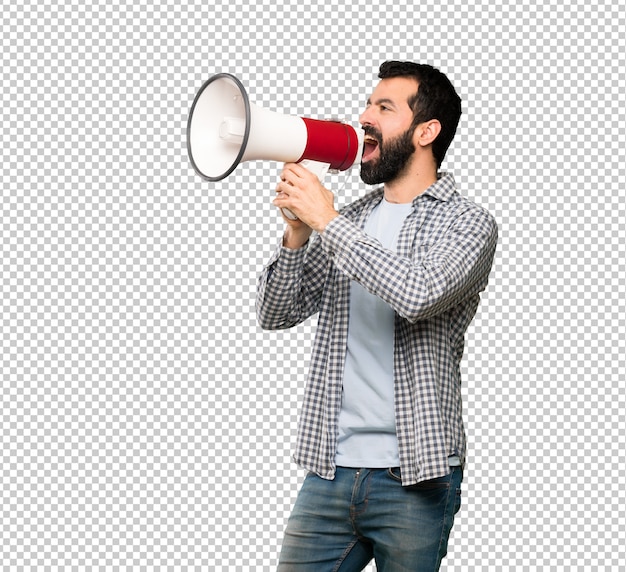 Handsome man with beard shouting through a megaphone