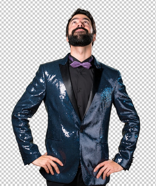 Handsome man with sequin jacket looking up