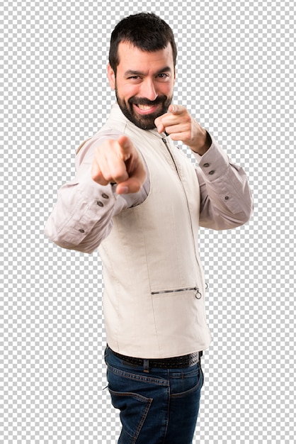 Handsome man with vest pointing to the front