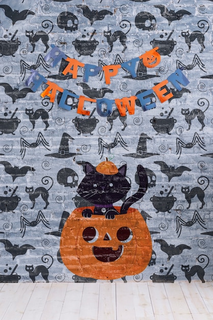 Happy halloween garland and pumpkin with cat on it