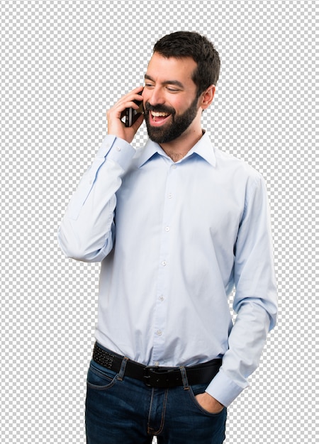 Happy Handsome man with beard talking to mobile