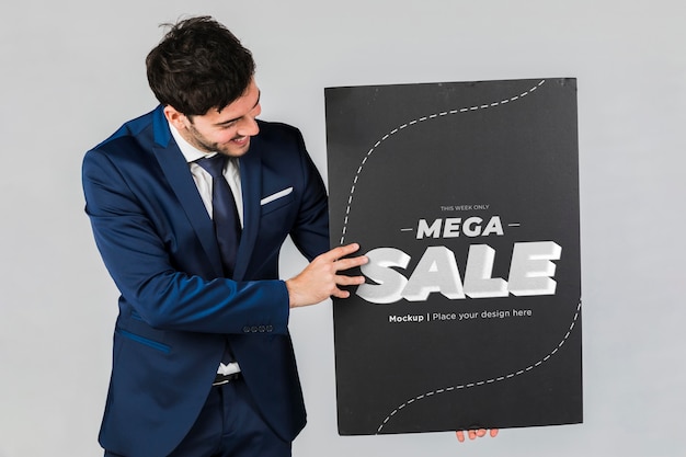 Happy man holding a placard concept mock-up