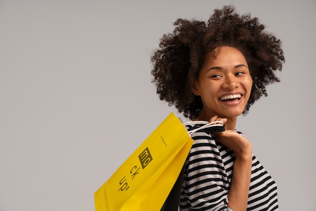 Happy woman with shopping bag mockup