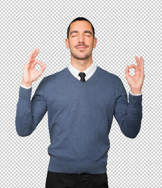 Happy young man doing a gesture of meditation