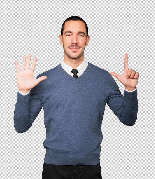 Happy young man doing a number seven gesture with his hands