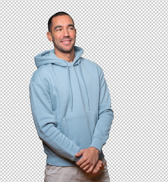 Happy young man posing against background