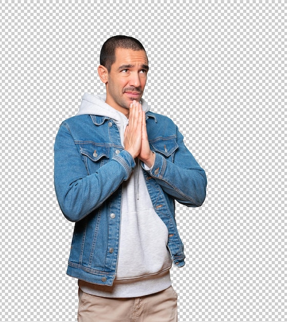 Happy young man praying gesture