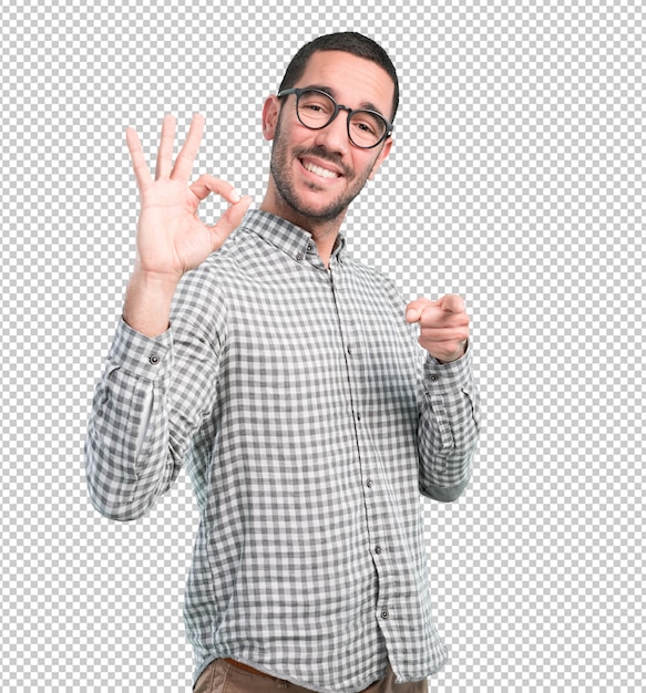 Happy young man with okay gesture