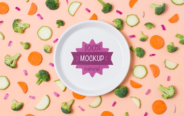 Healthy food mock-up plate with carrot and broccoli