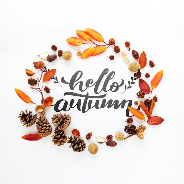 Hello autumn quote in a circle of dried leaves