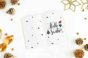 PSD hello santa christmas greeting in a notebook mockup