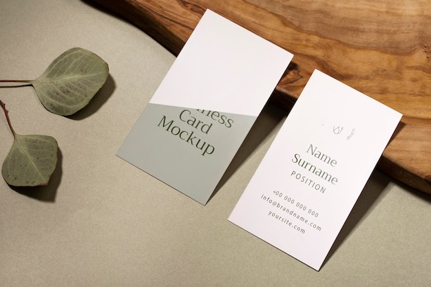 High angle business cards and leaves