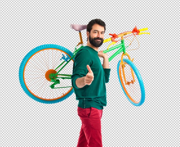 Hipster with thumb up holding a bike