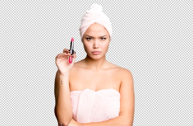 Hispanic pretty young woman wearing bathrobe beauty and make up concept