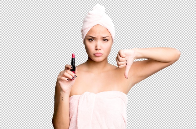 Hispanic pretty young woman wearing bathrobe beauty and make up concept