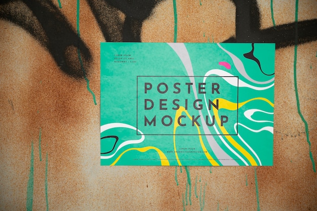 Horizontal poster mockup on wall