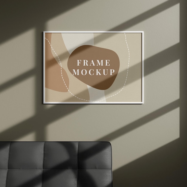 Horizontal white picture poster frame mockup on brown wall with shadow