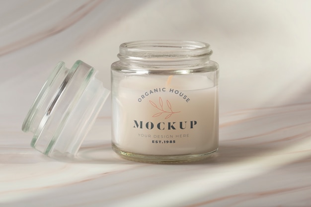 Indoor wax candle in glass jar with label mock-up