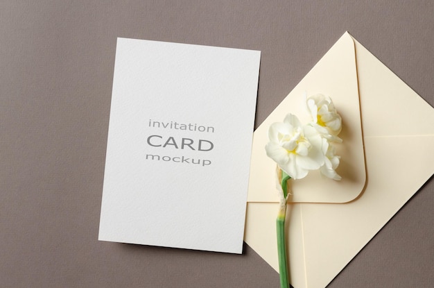 Invitation card mockup with envelope and daffodils flowers