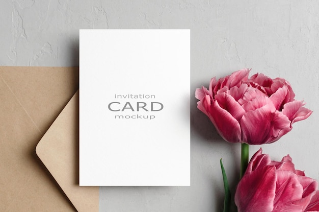 Invitation card mockup with envelope and pink tulips flowers