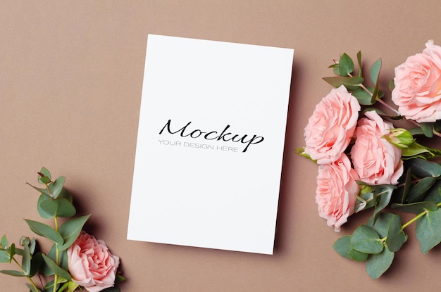 Invitation card mockup with fresh pink roses and eucalyptus flowers