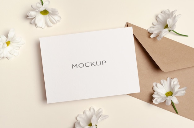 Invitation or greeting card blank mockup with envelope and flowers