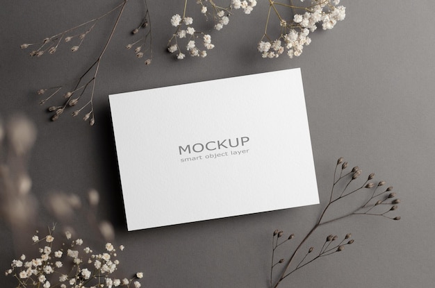 Invitation or greeting card mockup with dry flowers twigs