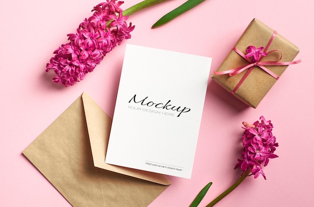 Invitation or greeting card mockup with gift box and spring hyacinth flowers