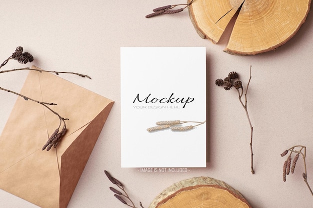 Invitation or greeting card sationary mockup with dry tree twigs and cut log decorations