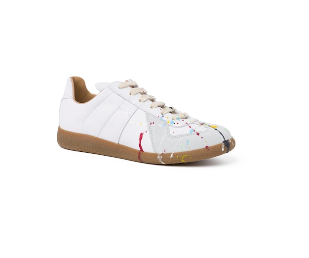 Isolated hand painted white canvas shoes angle view