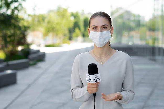 Journalist holding a microphone mockup