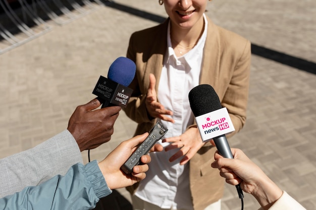 PSD journalist holding a microphone mockup