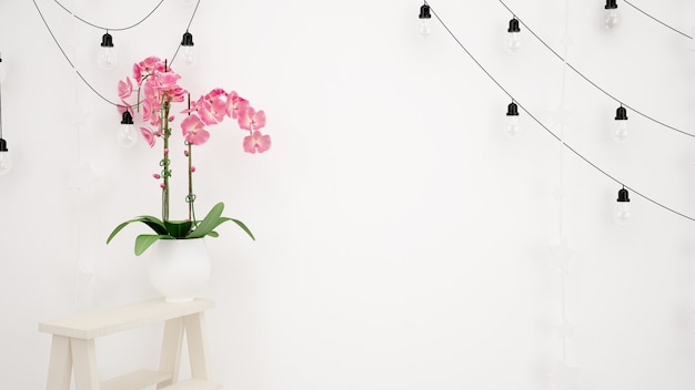 Lamps hanging on white wall and beautiful decorative pink flower