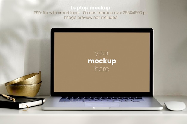 Laptop mockup on white desktop