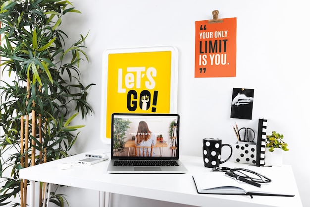 Laptop mockup with workspace composition