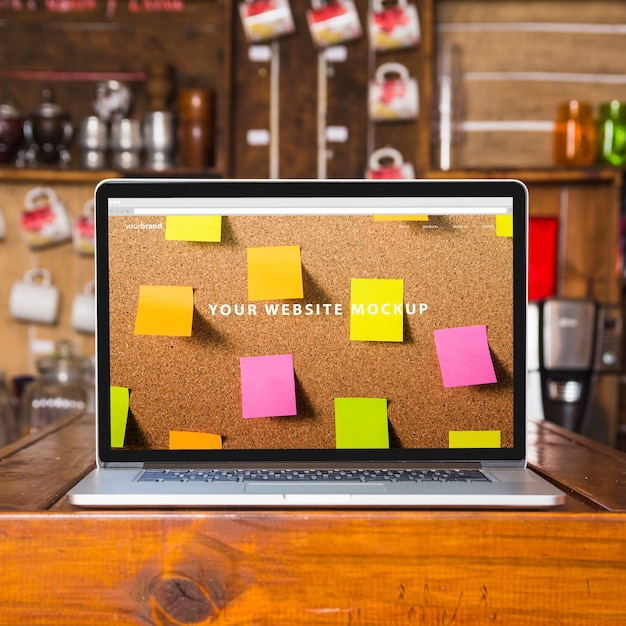 Laptop mockup on wooden table