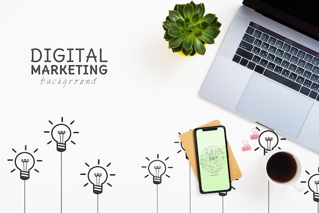 Laptop and smartphone on a digital marketing background