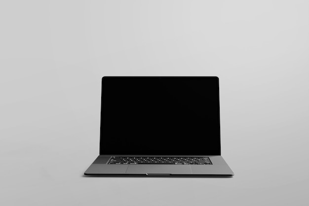 PSD a laptop that is turned off with a black screen that says  touch