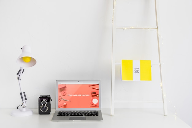 Laptop with mockup screen in clean and tidy workspace. education theme