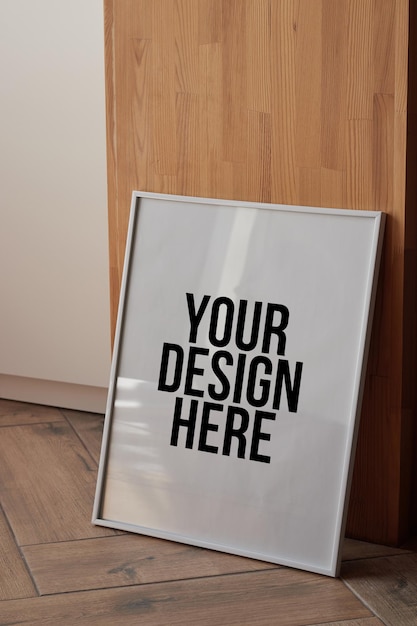 Large white photo frame on the floor mockup PSD poster on the wall dark background