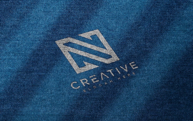 Logo mockup on blue fabric texture