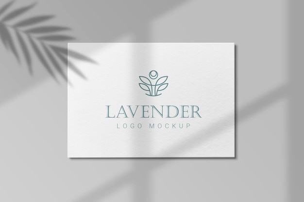 Logo mockup luxury on paper on a wall with shadows