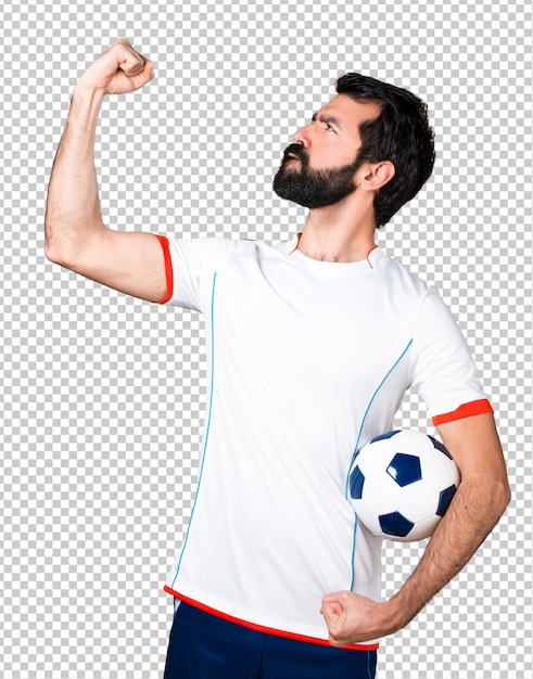 Lucky football player holding a soccer ball