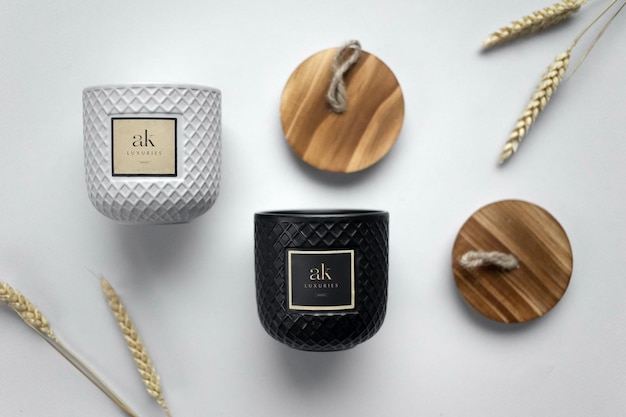 Luxury logo mockup on the black and white candle jars