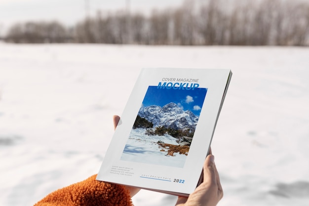 PSD magazine mockup held in hand