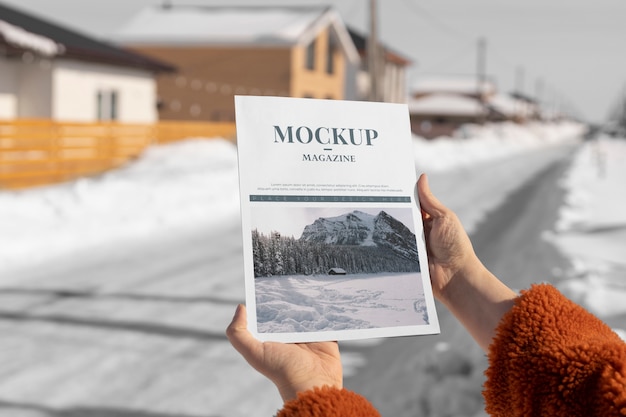 PSD magazine mockup held in hand