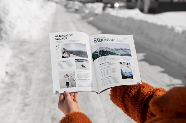 PSD magazine mockup held in hand